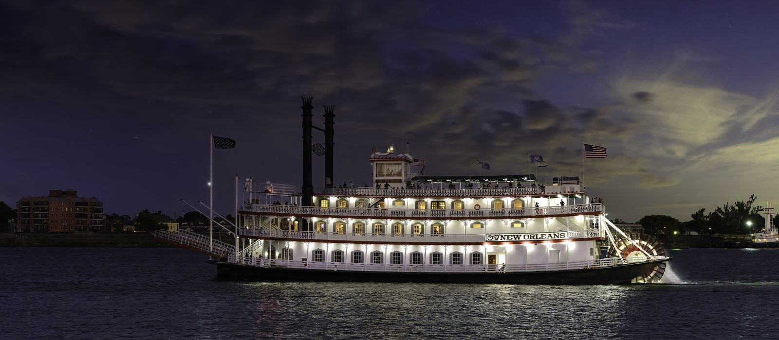 Paddlewheel riverboat on the Mississippi at night